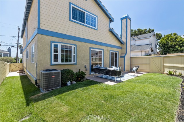 The backyard offers plenty of space for outdoor activities and extra storage space. I spy a central AC Unit!