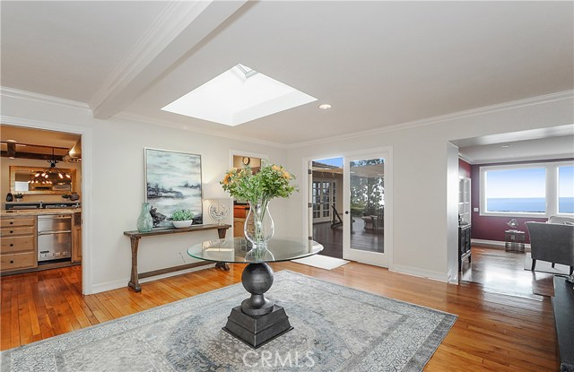 Gracious front entry.  French doors to the rear deck and fire pit surrounded by lounging chairs.