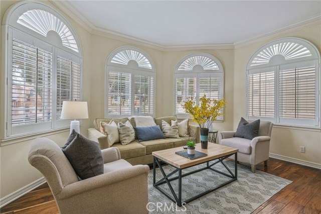 Light filled living room looks out to front courtyard