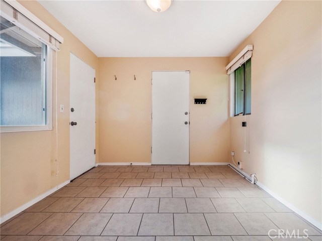 The bonus/mudroom, accessing the kitchen and the garage can serve as a spare room, home office, storage and more.