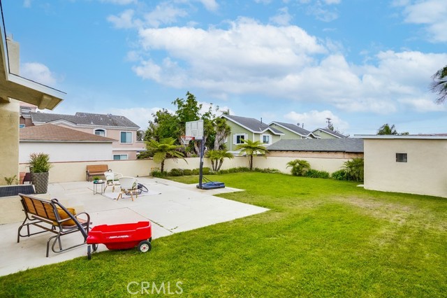 Back yard w outdoor storage or playhouse to the left of photo