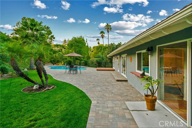 Large yard with custom pavers.