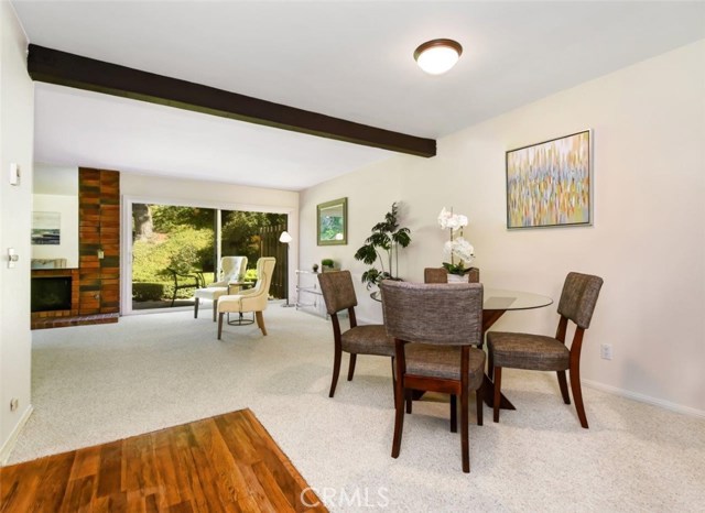 Dining Area and Living Room Overlook the Serene Wooded Setting