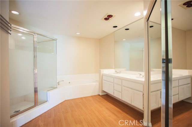 Enjoy the soaking tub, dual sinks and extra large shower with a seating ledge