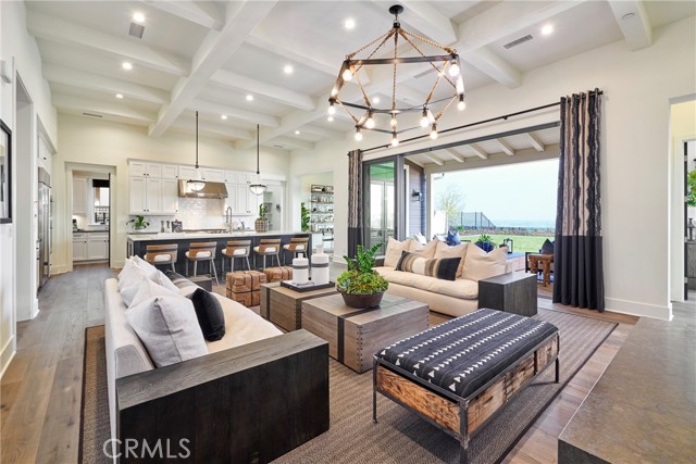 Great room and kitchen open to the covered patio and back yard for easy indoor-outdoor living.