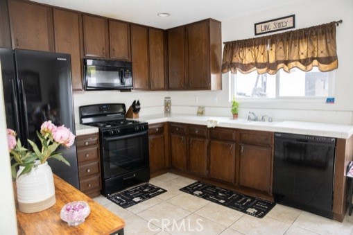 Spacious Kitchen with tile counters and tons of cabinets