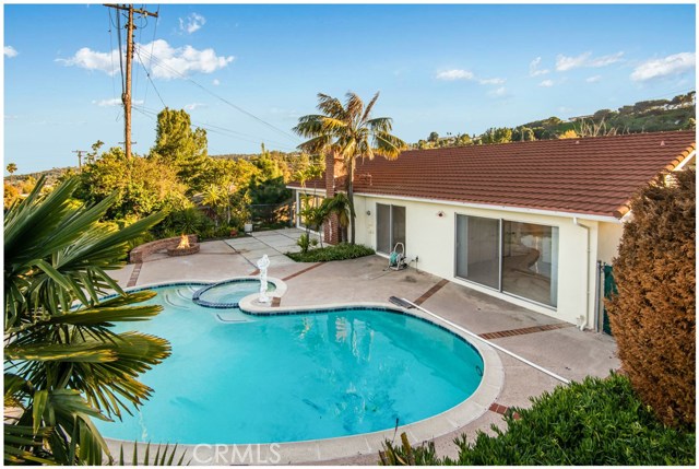 Backyard - Heated Swimming Pool and Spa, Built-in Fire Pit with Seating.