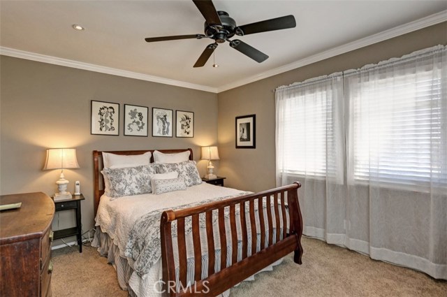 Master bedroom with walk-in closet, smooth ceilings and recessed lighting.