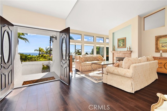 Living Room with fireplace and a full wall of windows