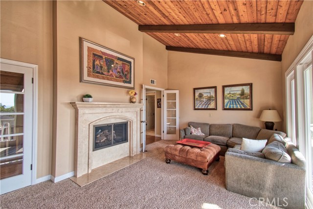 Fireplace & glass french doors make this room warm & inviting