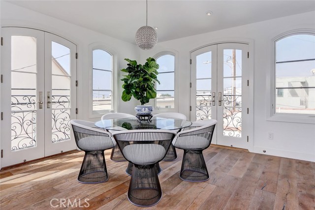 Dining area with two sets of French doors by Marvin