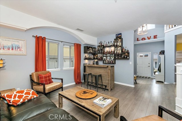 Living room with view toward entryway.