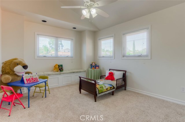 The second bedroom upstairs boasts vaulted ceilings, new carpet and a cozy bench seat.