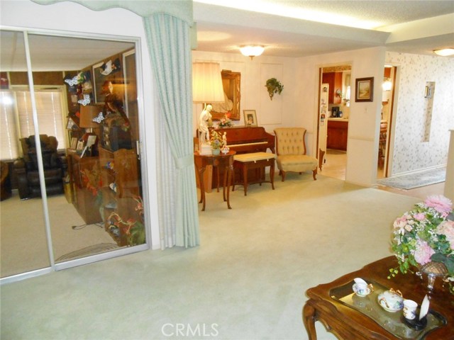 Angle of Formal Living Room overlooking the Enclosed Patio, Open Formal Dining Room, Kitchen, Formal Entry Way...Keep Looking Around.