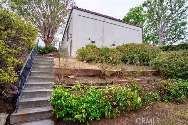 Stairs leading to garage and bonus room