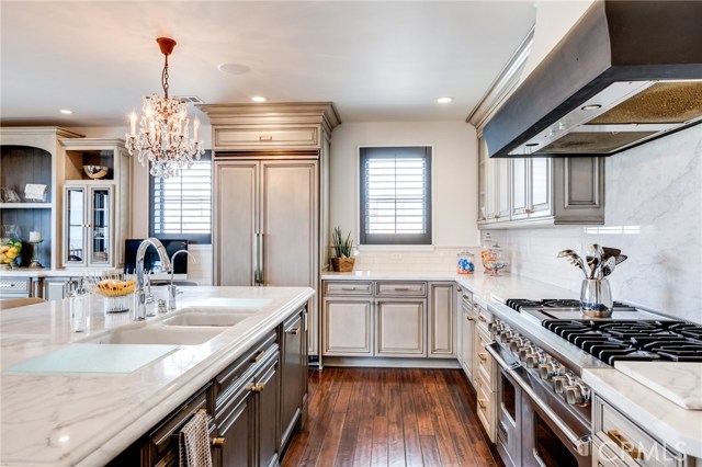 The 6-burner stove has a griddle, double oven and hood