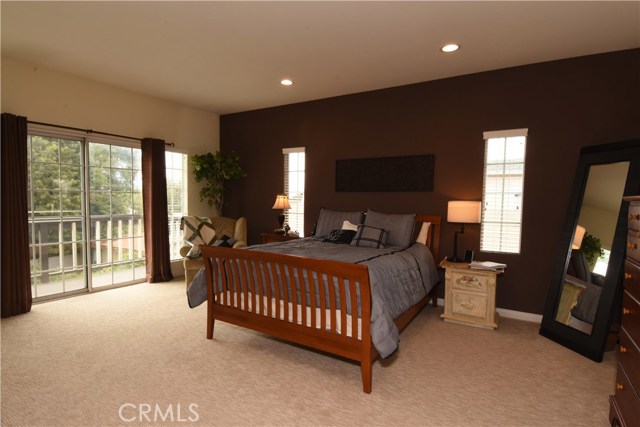 Large, romantic master bedroom suite with slider to a balcony that overlooks the rear yard