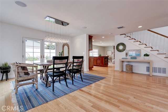 Large dining area leads to backyard.