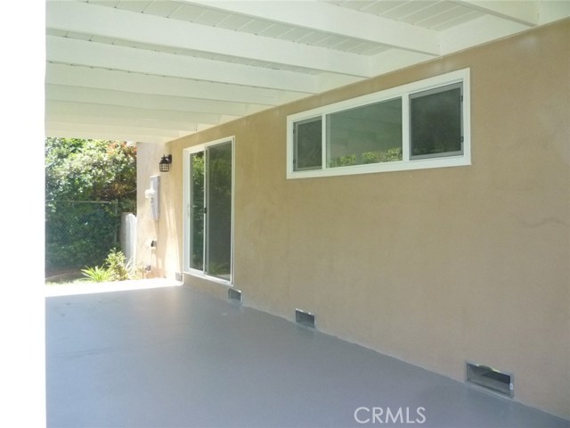 Covered patio in the large backyard.