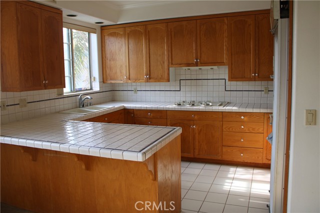 Kitchen with original tile and custom built cabinets
