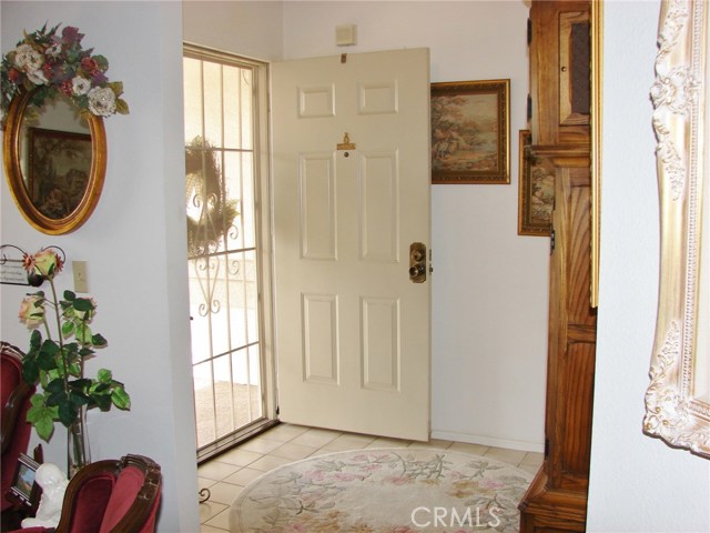 TILED ENTRY, THERE'S A COAT CLOSET (BEHIND FRONT DOOR) HALLWAY ON LEFT LEADS TO BEDROOMS. LIVING ROOM TO RIGHT.