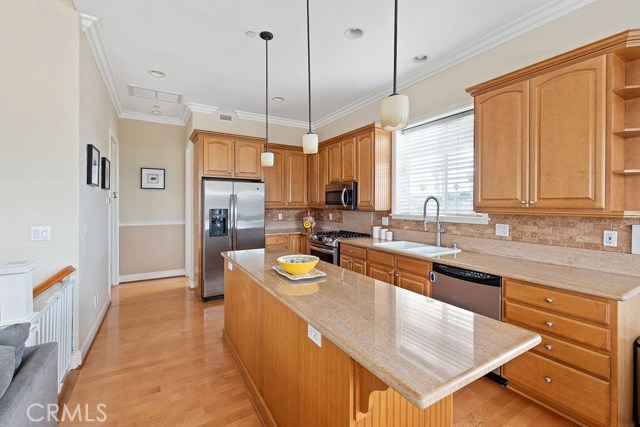 Natural sunlight, expansive counter tops, high ceilings, integrated under and over cabinet lighting