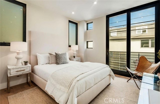 Also on the second level is another bedroom. This bedroom faces east and includes a private balcony and en-suite bath