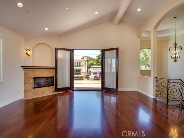 Another view of living room with balcony visible.