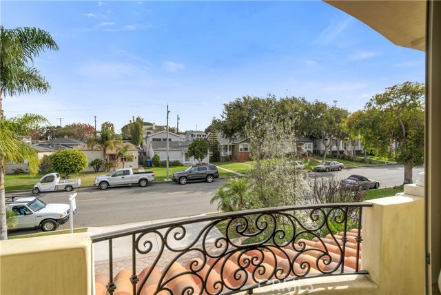 Balcony off front bedroom shows great neighborhood