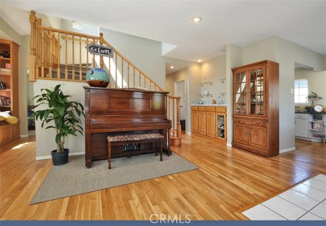 Upon entering the dining area is to the right and the family room to the left -  the wet bar facing the stairs