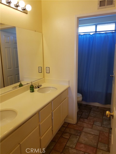 Upstairs Hall Bathroom Includes Dual Sinks And Shower/Tub Combination.