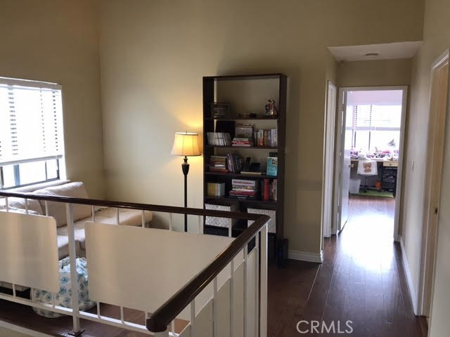 Additional work desk, library reading nook area with a view to the 2nd bedroom with lots of natural light and then the 3rd bedroom is to the left and is the corner bedroom that is also light and bright.