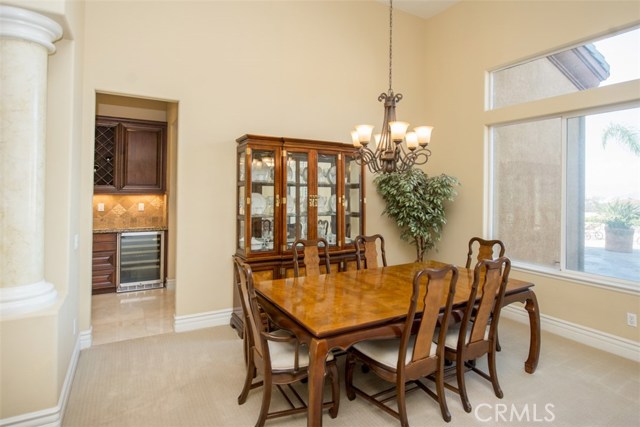 Formal Dining Room with Dry Bar, Wine Rack and Wine Refrigerator.