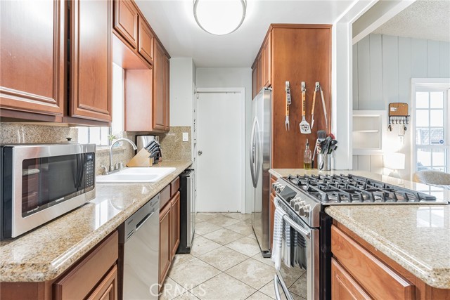 Kitchen that leads to one car garage