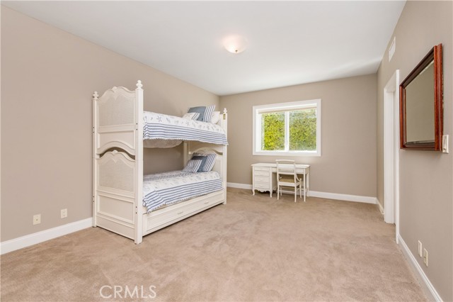 Bedroom 3 on lower level with walk in closet and ensuite bath.