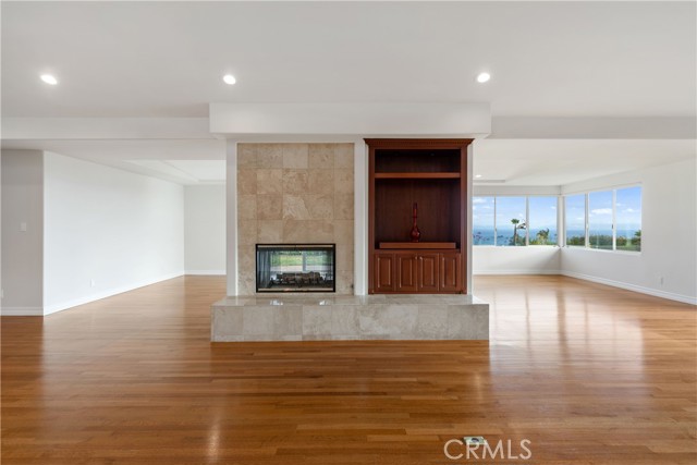 The view is there almost as soon as you walk in. Hardwood floors throughout main living areas.