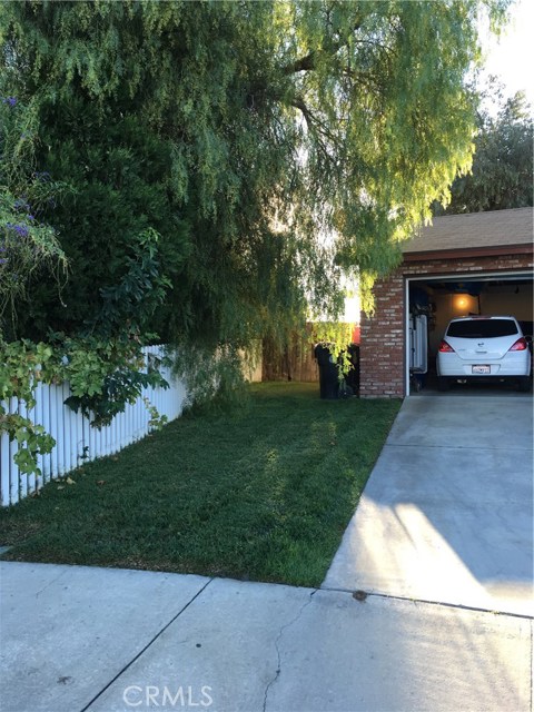 The wide side yard has the potential to allow back yard access for your outdoor toys or standard car