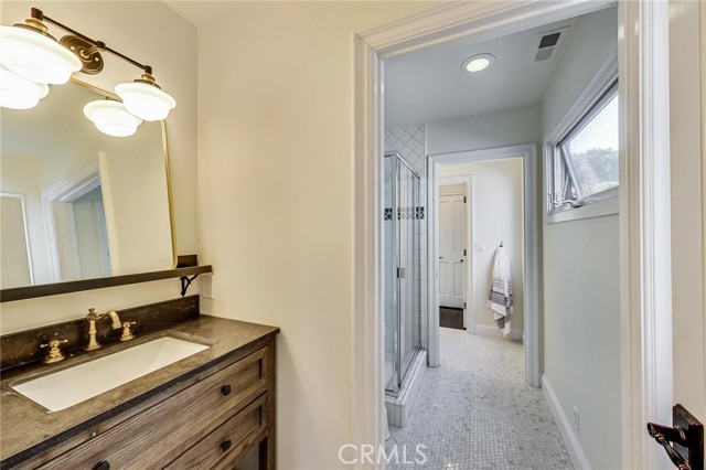 2 brand new vanities and tile flooring in Jack n Jill bathroom. So the layout is vanities on each side of large shower stall and toilet in the middle. This bathroom services both entry level bedrooms.