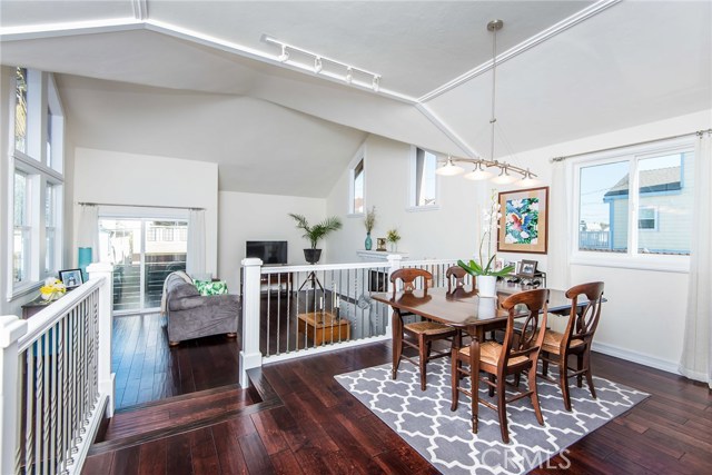 Open floor plan dining room overlooking living room.