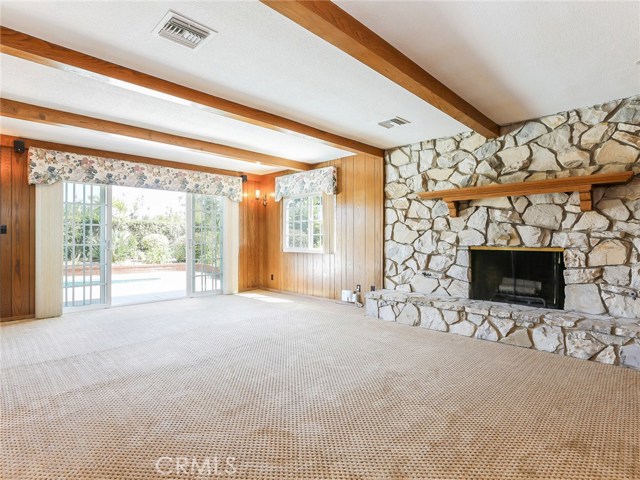Family room with doors to pool area