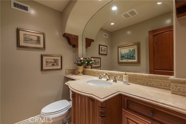 Elegant guest half bath on entry level.
