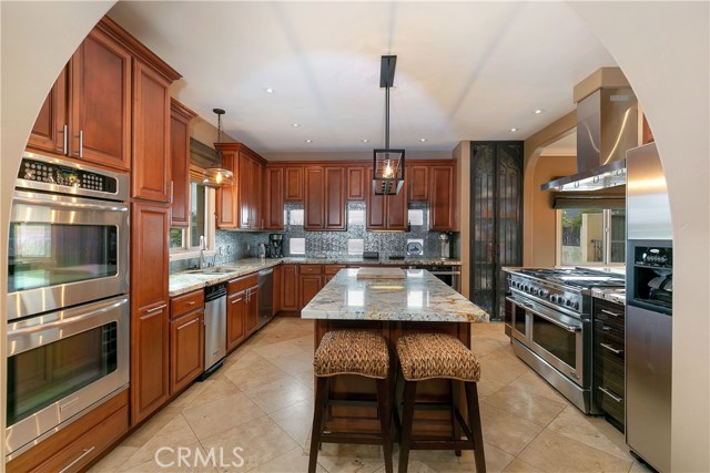 amazing  kitchen situated between family & living rooms