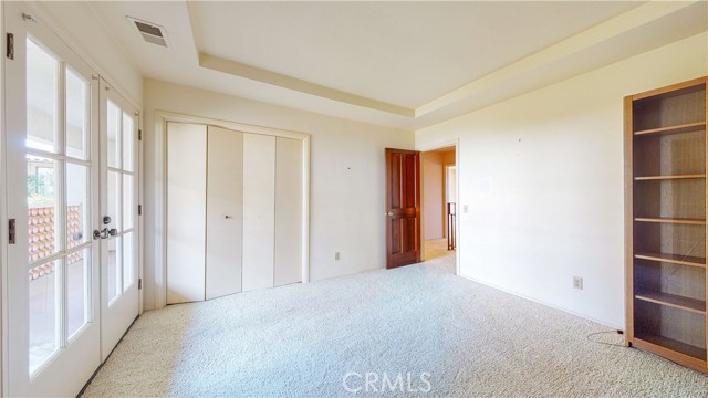 Upstairs bedroom with bookcases