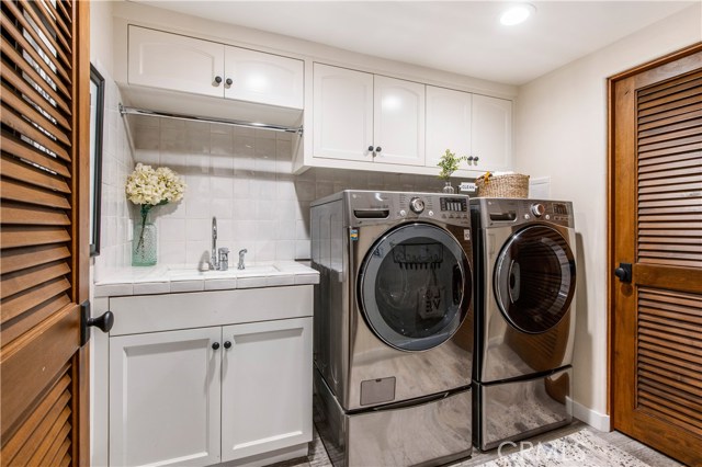 Laundry room and bonus storage room located on lower level.