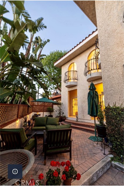 COURTYARD ENCLOSED WITH LUSH TROPICAL PALMS