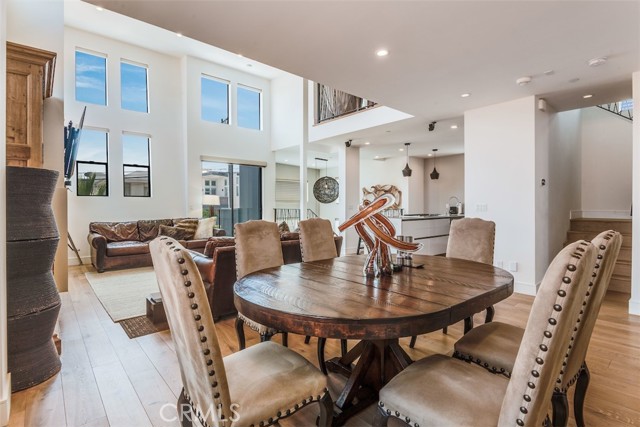 Dining room opens to the expansive living room and kitchen