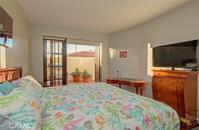 Primary bedroom with private, west-facing patio.