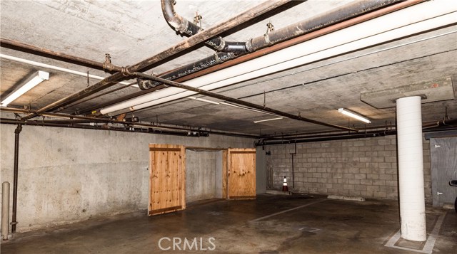 Two large tall lockable storage cabinets & 2 side-by-side parking spaces (AG16 & 17) in secure subterranean garage