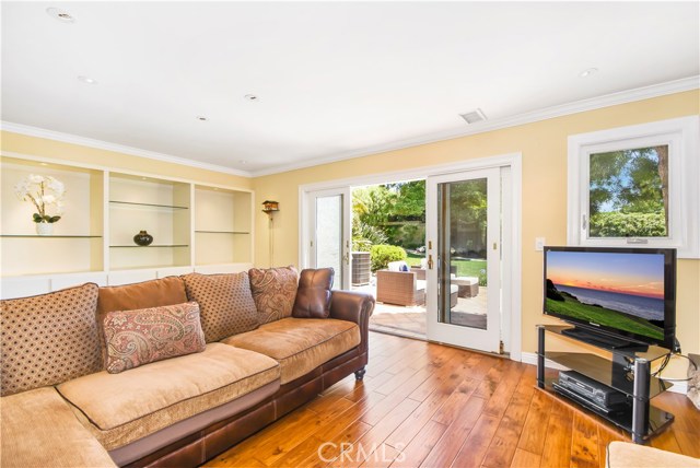 Family Room Opens to an outdoor Patio Through French Doors