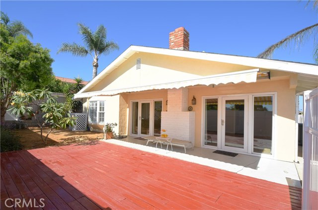 Backyard deck, Plumeria, trees, view to house